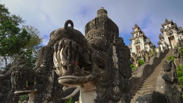 Slowmotion Handheld Shot of Stone Dragons Guarding the Stairs in the Pura Lempuyang Temple at the