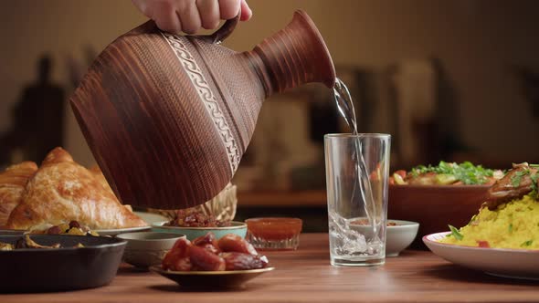 Pouring Water Muslim Family Dinner Ramadan Iftar