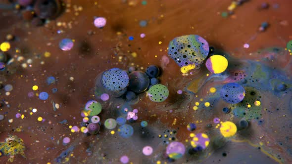 Abstract Colorful Acrylic And Food Paint Bubbles On Water  alt