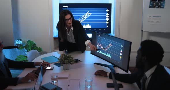 Business woman explaining trading strategies inside bank meeting room