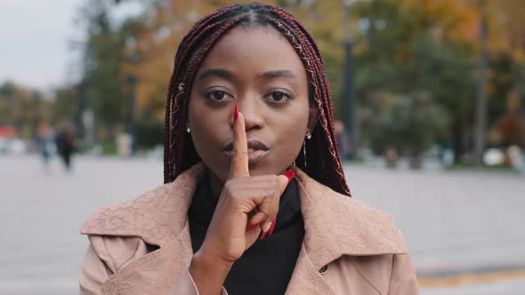 Closeup Young Confident Mysterious African American Woman Standing Outdoors Showing Silence Gesture