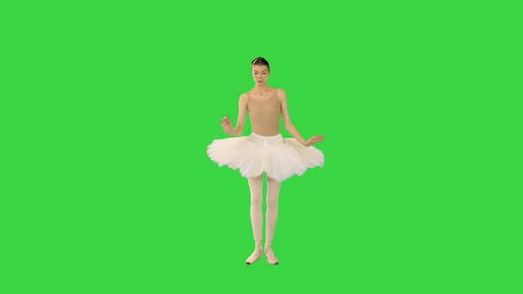 Young Ballerina Walks Demipointe Raising Arms on a Green Screen Chroma Key