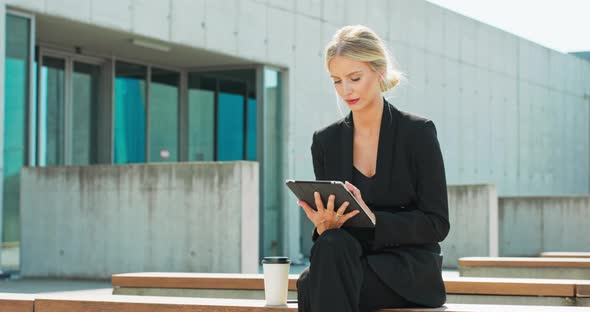 Business Working Woman Sit and Using Digital Tablet at Outdoor Front View Social Communicate