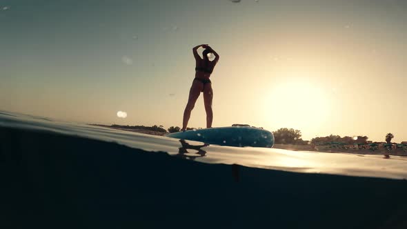 Body Stretching on a Surf Board