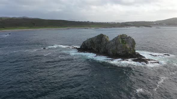 Flying Above Sea Stacks at the Beautiful Coast at Maling Well, Inishowen - County Donegal, Ireland