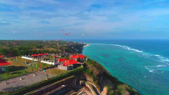 Exotic Island In The Ocean. Paragliders