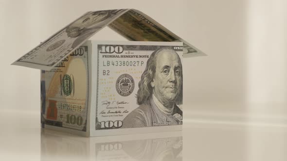 Tilting on USD paper currency built home 4K 2160p 30fps UltraHD footage - Real estate metaphor made 