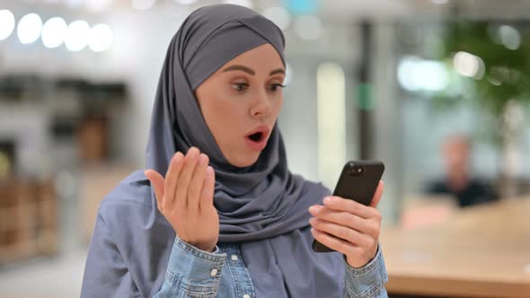 Arab Woman Reacting To Failure on Smartphone 