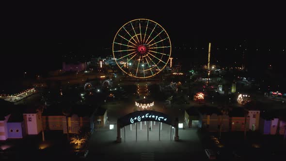 Flying over Amusement Park Tsitsinatela at night. Shekvetili, Georgia 2020