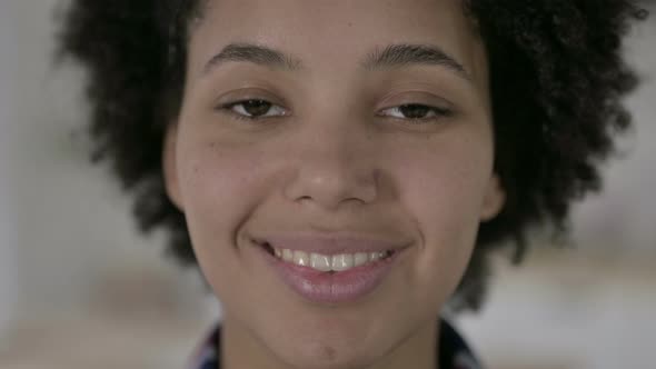 Close Up of Cheerful African American Woman Smiling at Camera