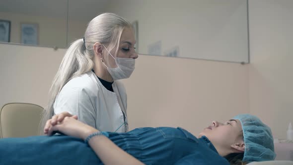 Woman Lies on Couch and Talks with Brow Master in Salon