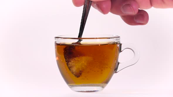 Second Teaspoon of Sugar in Cup of Tea. Slow Motion