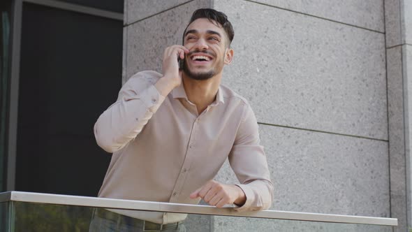 Portrait Happy Smiling Hispanic Arabian Man Hispanic Male Standing on Balcony Terrace at Home