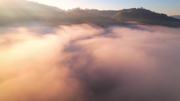 4K Aerial Flying Above Sea of Fog at Sunrise