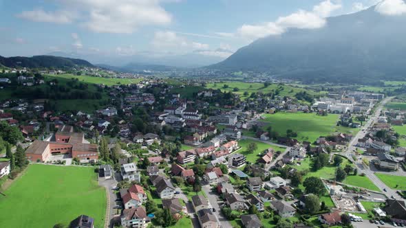 Aerial View of Liechtenstein with Houses on Green Fields in Alps Mountain Valley