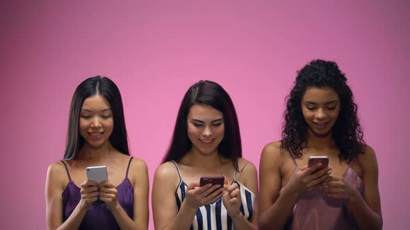 Three Adorable Multiracial Women Using Mobile Apps and Looking Up, Template