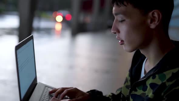 Young man using tablet in city