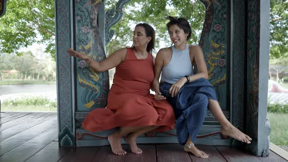 Women Sitting Inside The Decorated Pavilions On Ancient City Museum Park In Bangkok Thailand