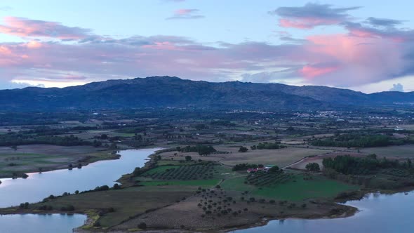 Lake drone aerial view of mountain panorama landscape at sunset in Marateca Dam in Castelo Branco, P