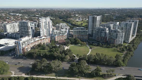 Aerial Shot Flying Backwards Along the Residential Apartments in Sydney Suburb with tall buildings a