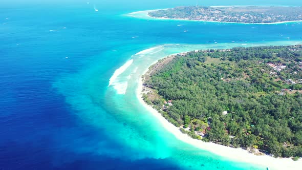 Aerial drone view sky of idyllic island beach lifestyle by blue ocean with white sand background of 