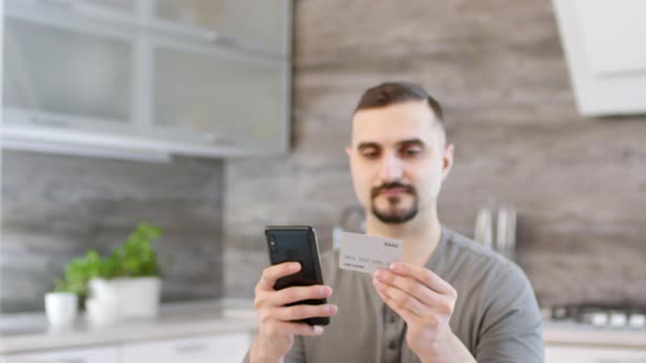 Portrait of Man Doing Online Shopping with Smartphone
