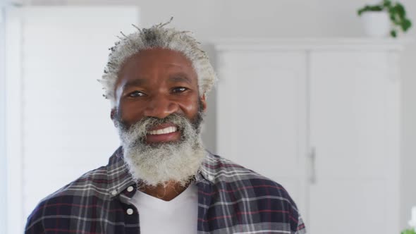 Senior man smiling at home