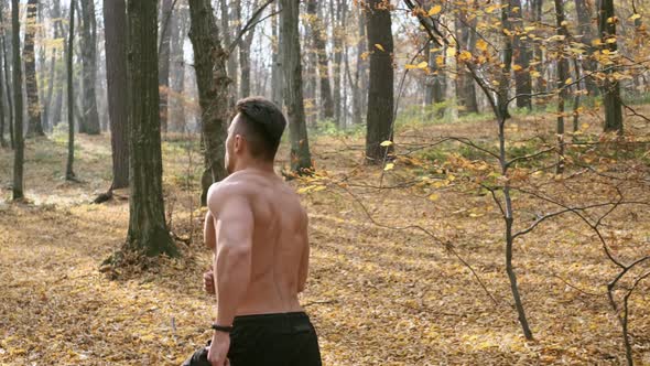 Athlete Jogging In The Forest.