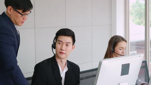 Business People Wearing Headset Working in Office