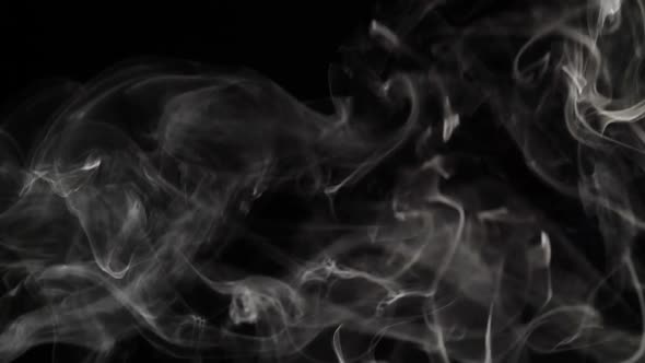 Smoke Billowing Over a Black Background