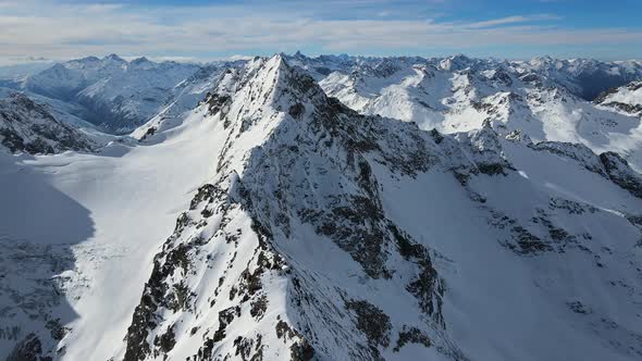 Aerial View of Cheget Mountain Range in Snow in Winter in Sunny Clear Weather