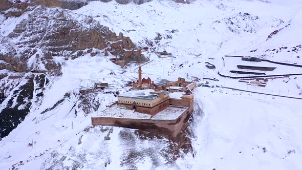 Aerial view of Ishak Pasha Palace on a snowy day in Dogubayazit, Turkey