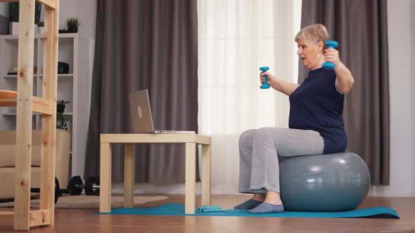 Senior Woman Training with Weights