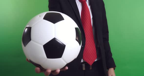 Businessman Holding a Soccer Ball