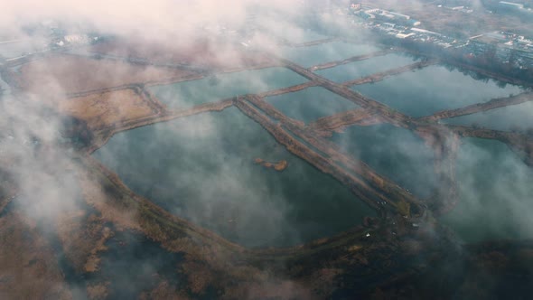 Aerial Drone View Flight Over White Clouds of Mist Artificially Created Lakes