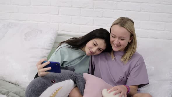 Two Young Multinational Girls Spending Time Together Pajama Party