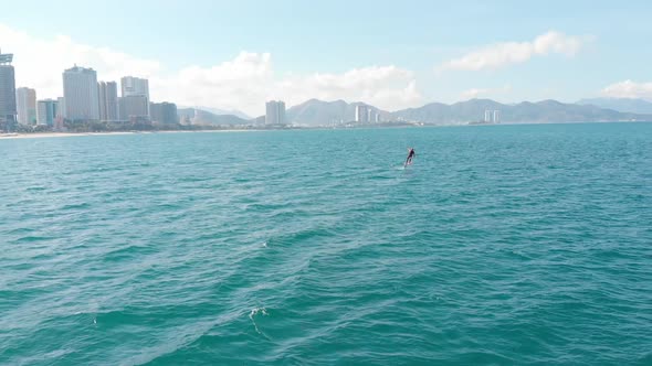 Kitesurfing Place, Sports Concept, Healthy Lifestyle, Human Flight. Aerial View of the City Beach