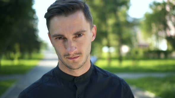 Portrait of Attractive Man Smiling Outdoors