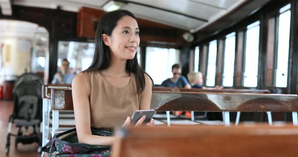 Young Woman taking ferry in Hong Kong 