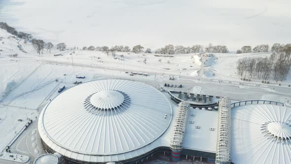 Top view in winter of a modern sports complex with parking in Minsk. Belarus