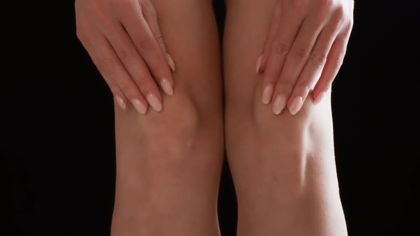 Unrecognizable Woman Massaging Her Painful Knees