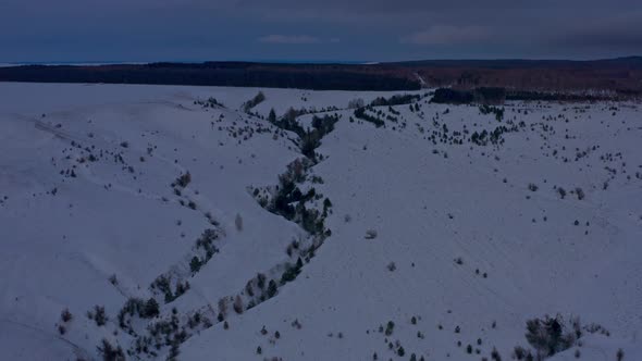 Snowcapped Mountains at Dusk in Winter