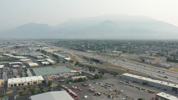 Aerial view over industrial business area slowly rotating in Utah County