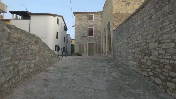 Paved alley and stone walls