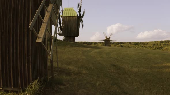 Landscape of Rustic Wooden Windmills on the Field