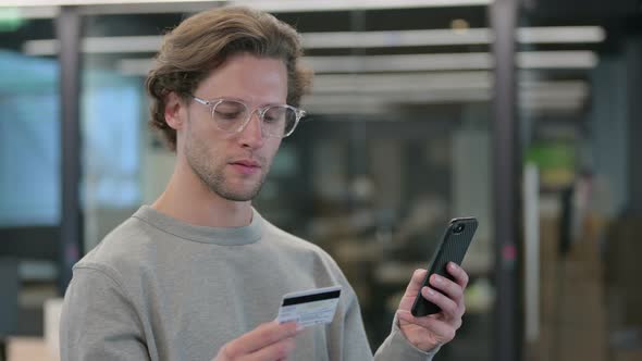 Portrait of Businessman Making Online Payment on Smartphone