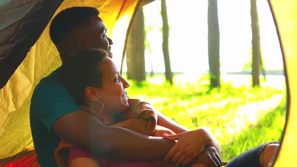 Mixed Race Couple Drinking Tea in the Park Camp