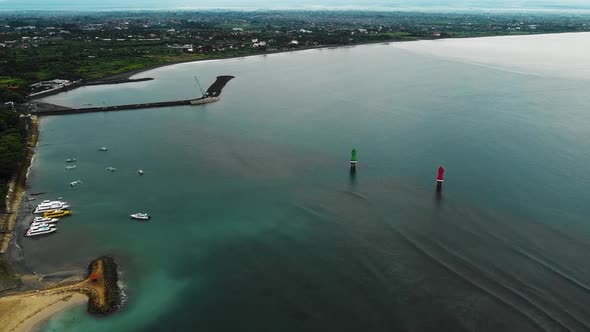 Beautiful cinematic Sanur beach, Bali drone footage with interesting landscape, fishing boats and ca