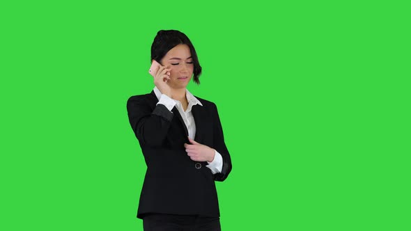 Business Woman Dancing After Making a Successful Call on a Green Screen, Chroma Key