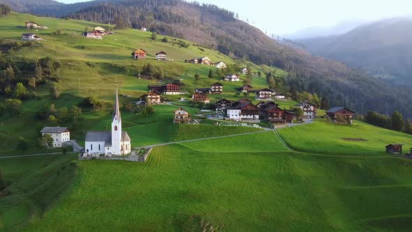 Aerial View of Villas and Church on Austrian Mountains